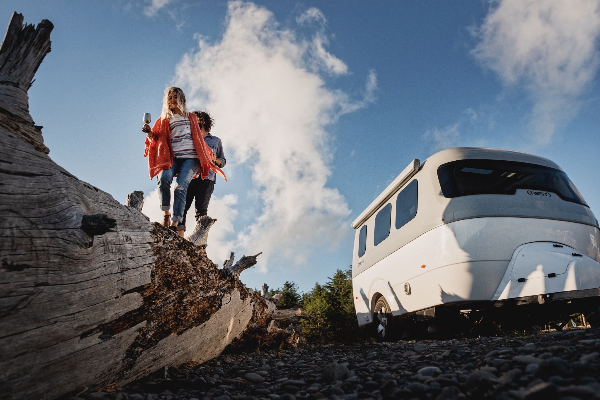 Nest by Airstream sky clouds woman man tree rocks adventure wheels shell awning