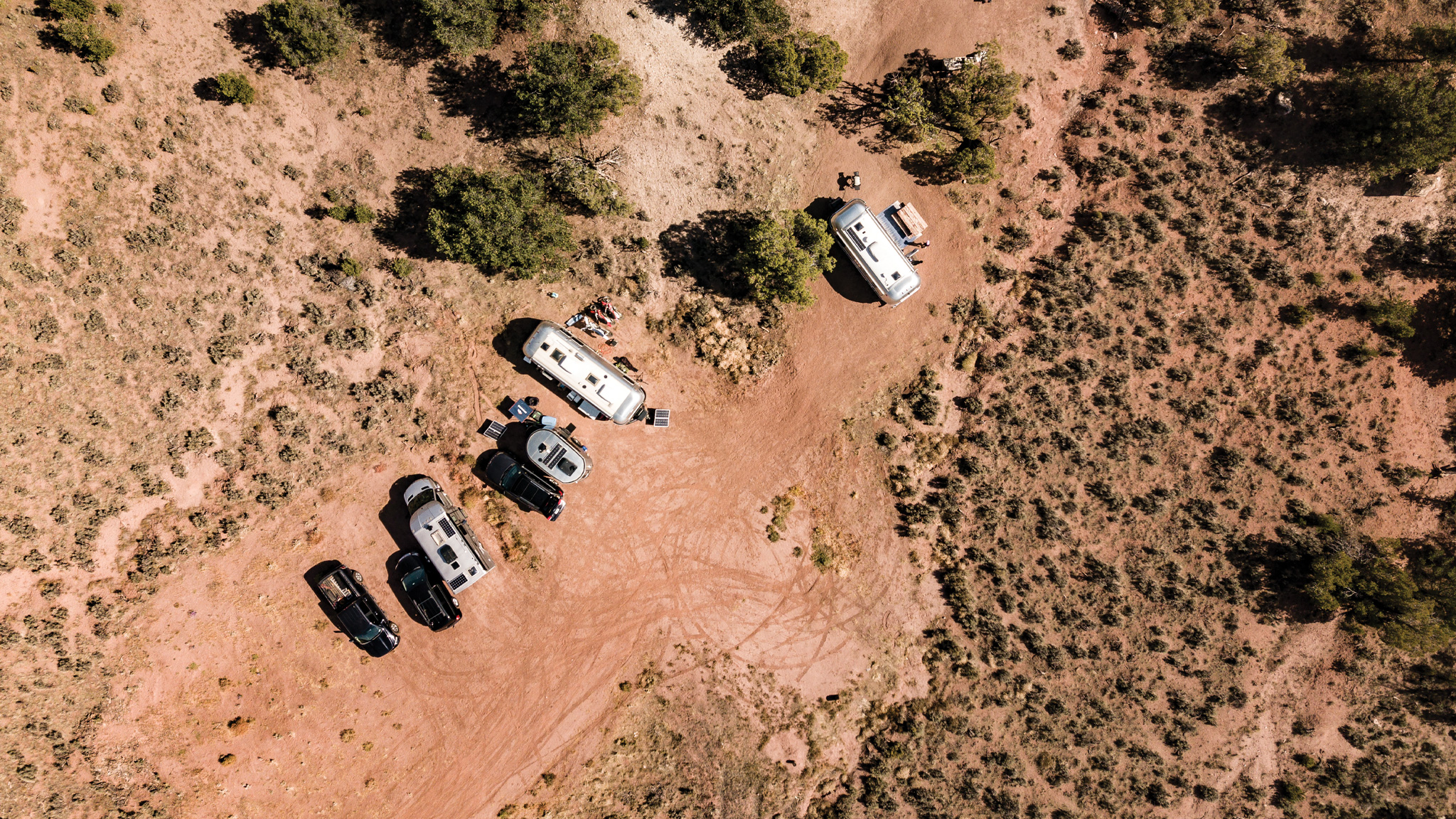 Different Airstream Travel Trailers parked next to each other in Sedona, Arizona with a top view of the area.
