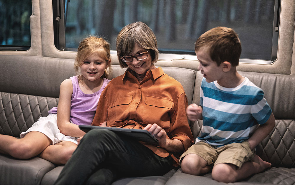 Sitting on the couch playing on a tablet