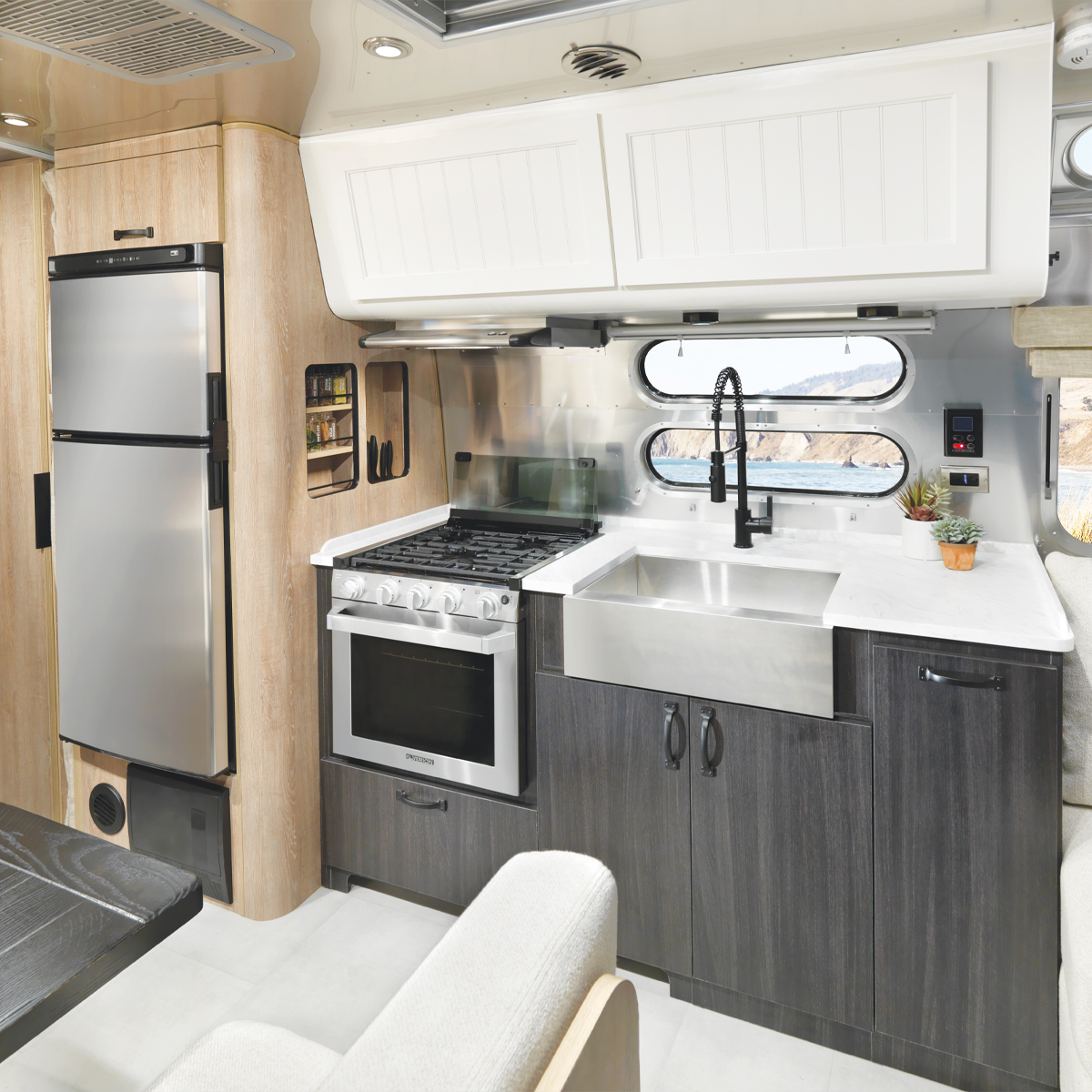 Airstream Pottery Barn Special Edition Travel Trailer kitchen with ocean in the background