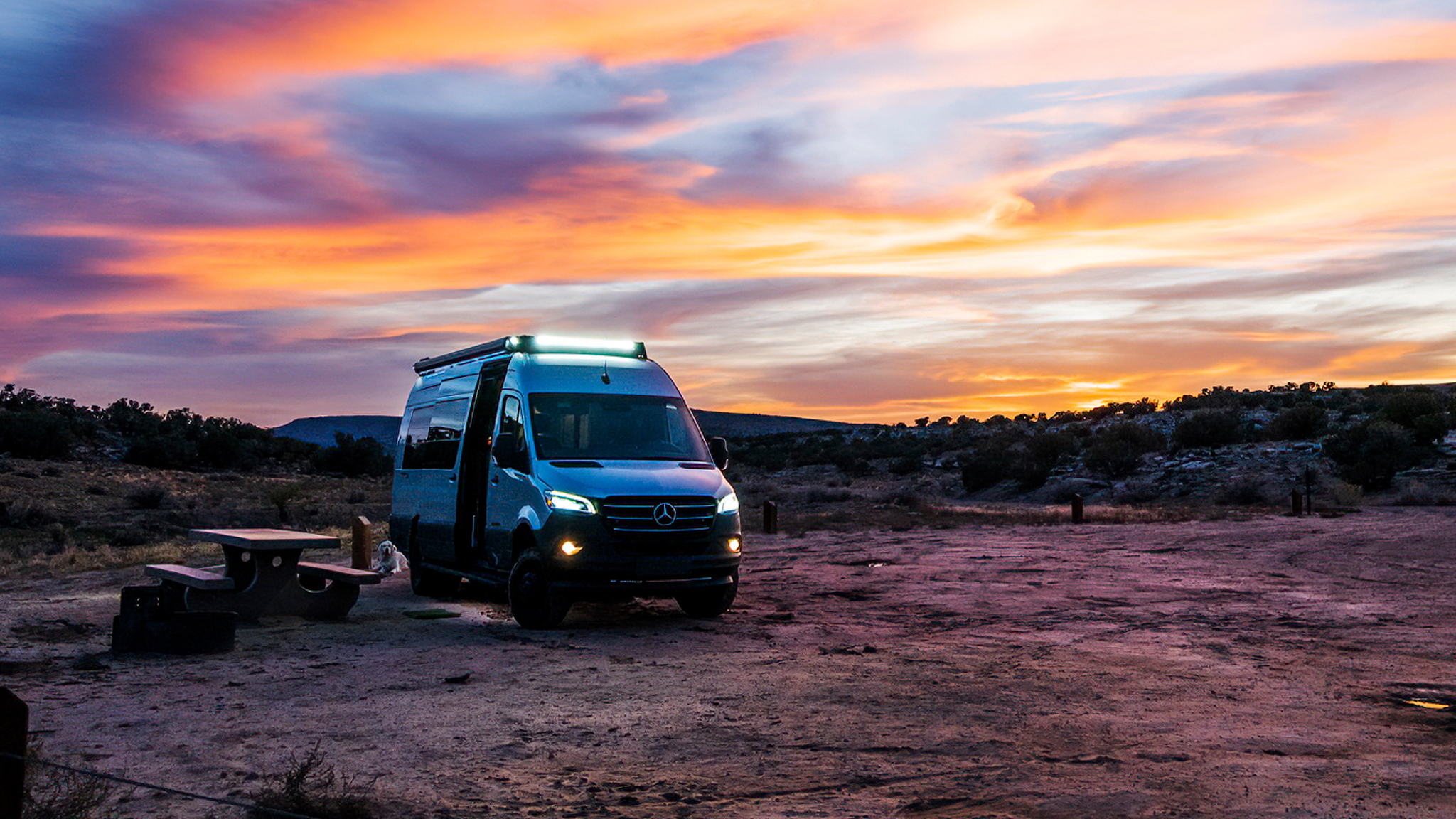 Airstream Interstate 24X Touring Coach sitting under the sunset
