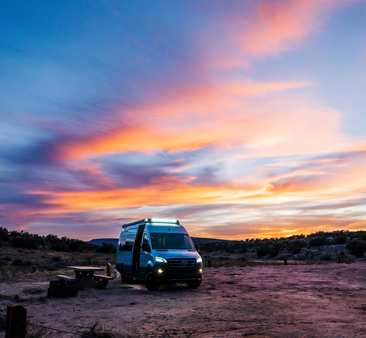 Airstream Interstate 24X Touring Coach sitting under the sunset