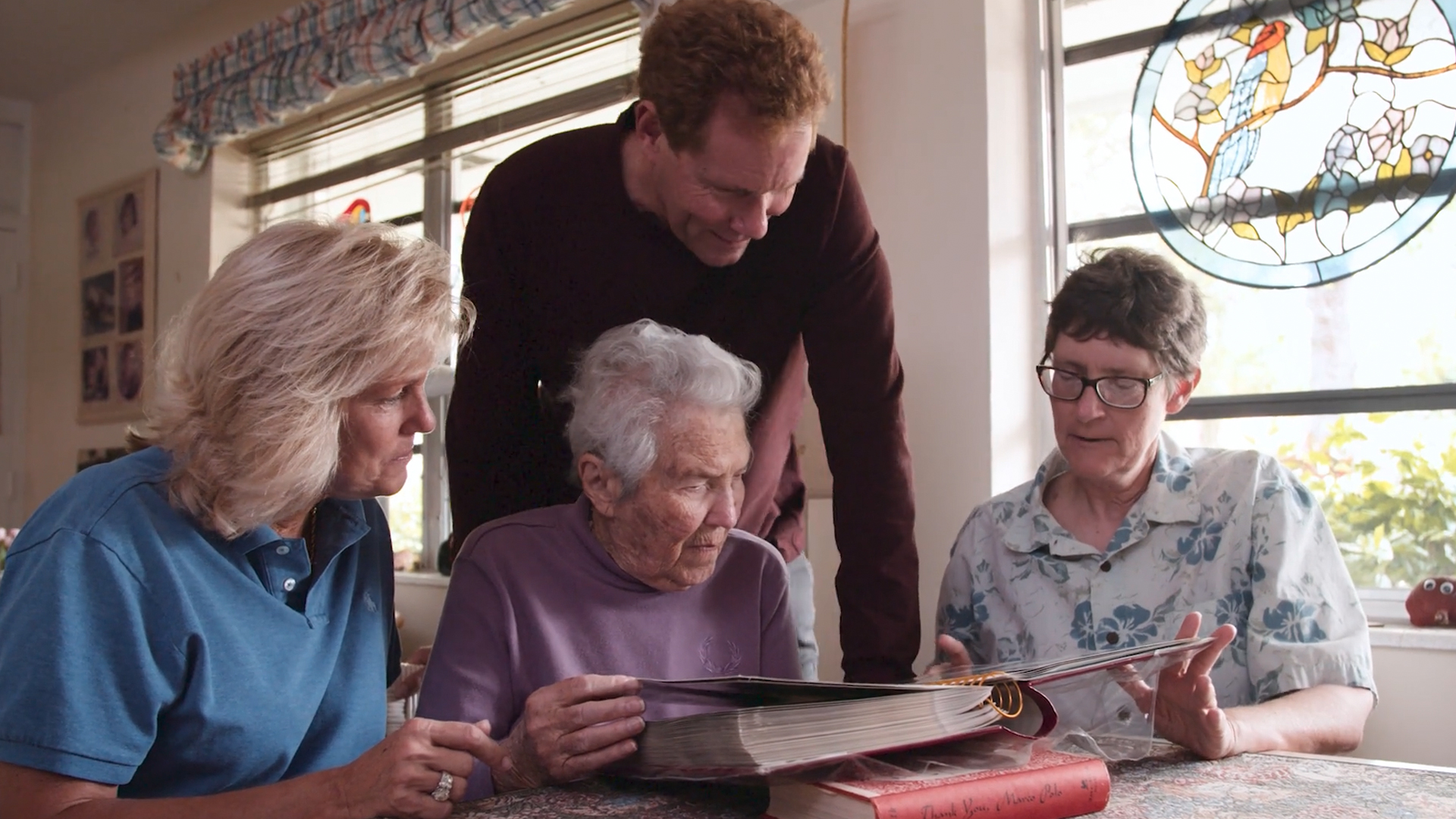 The Smith family looking through old photos of their Around the World Caravan with Airstream.