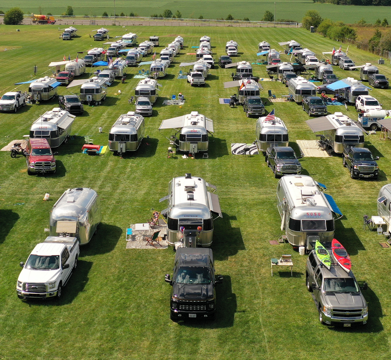 Many Airstream Travel Trailers and Touring Coaches parked at Airstream Headquarters during Alumapalooza in Jackson Center, Ohio.
