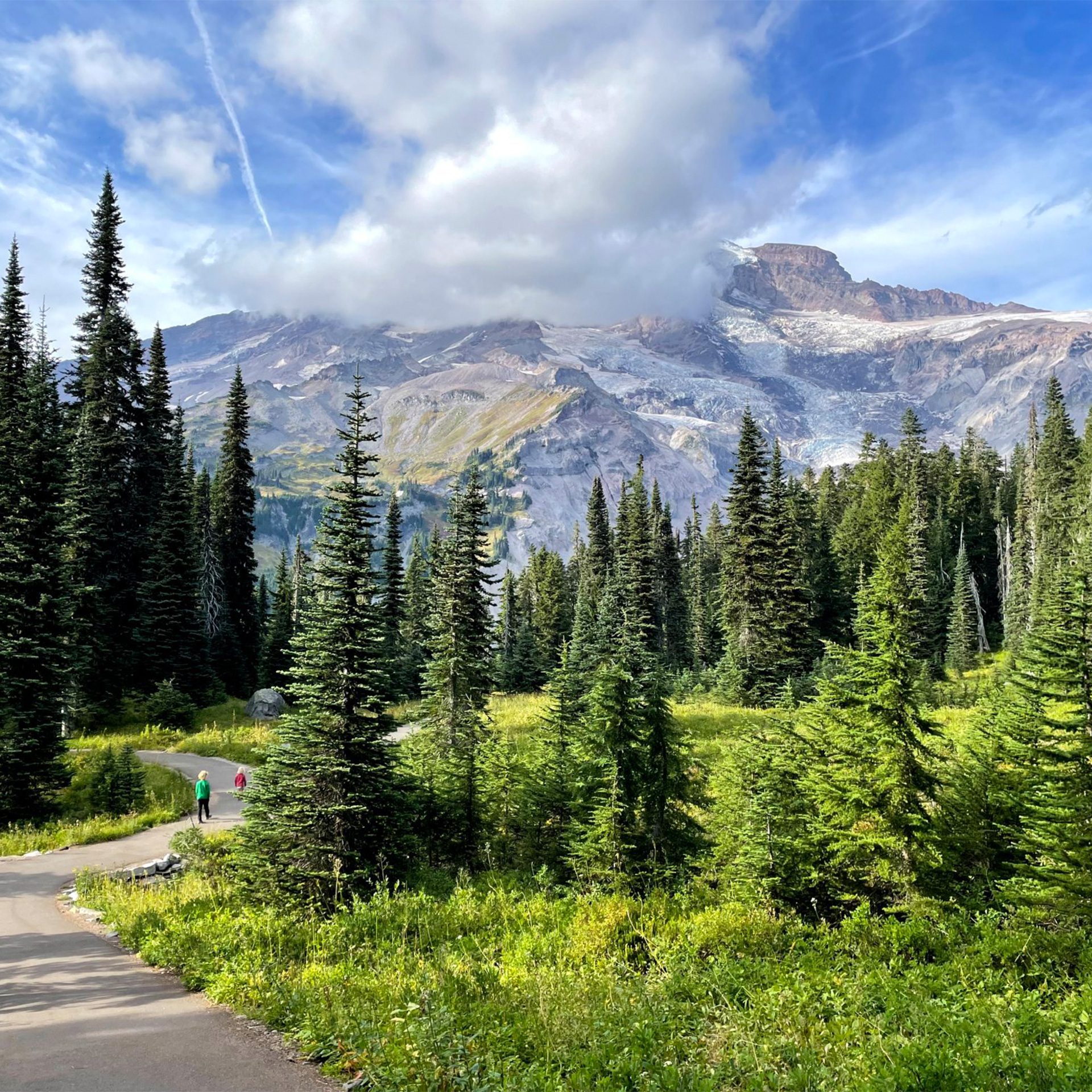 Children walking on a path through the mountains