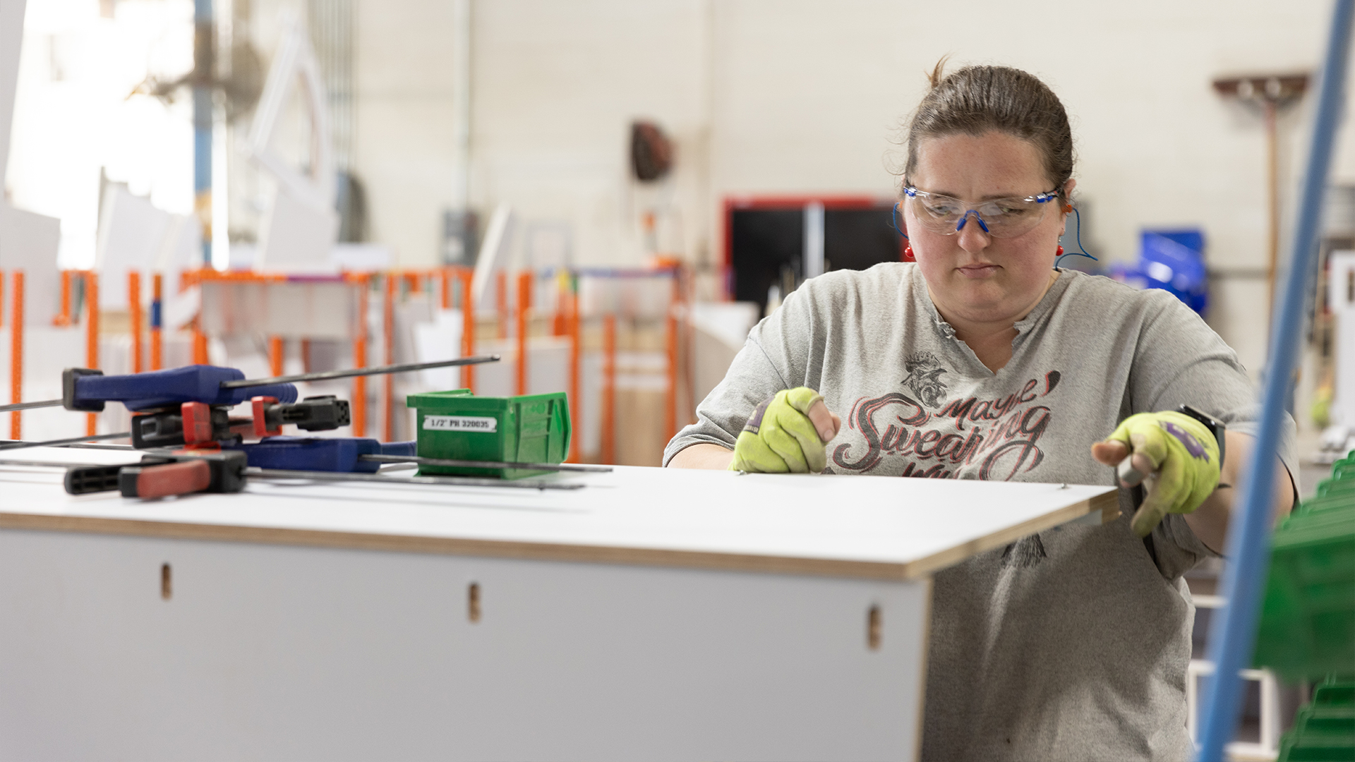 An Airstream employee building the cabinetry for the Airstream Basecamp travel trailer