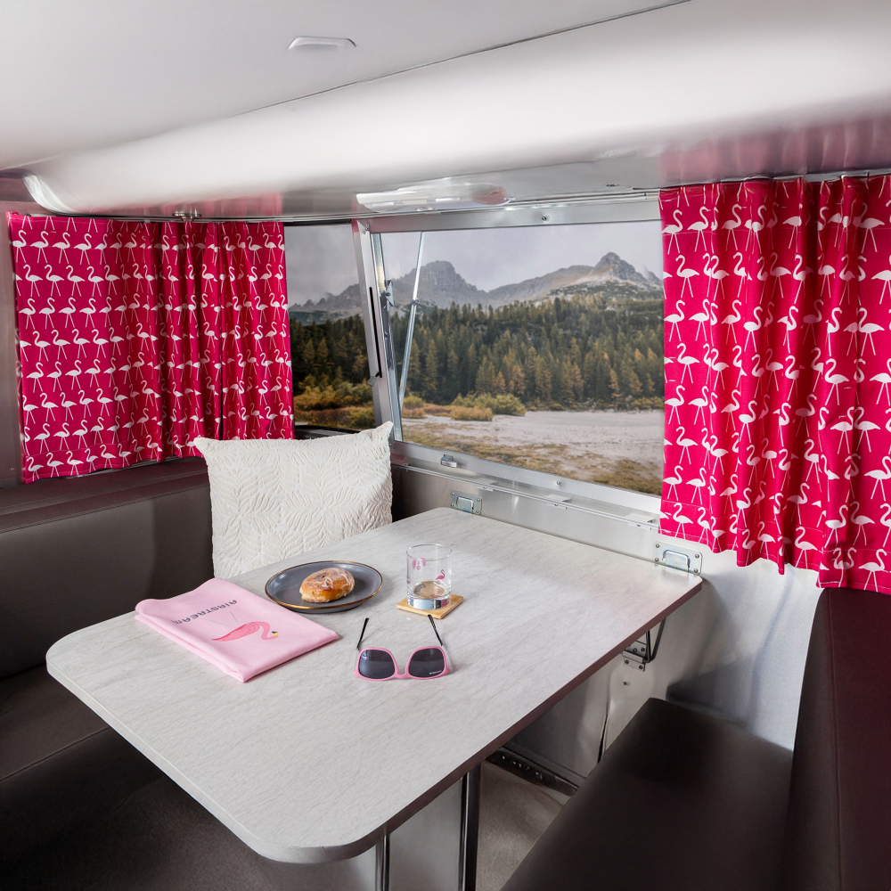 Airstream Dinette decorated with pink flamingo designed Airstream Supply Company products