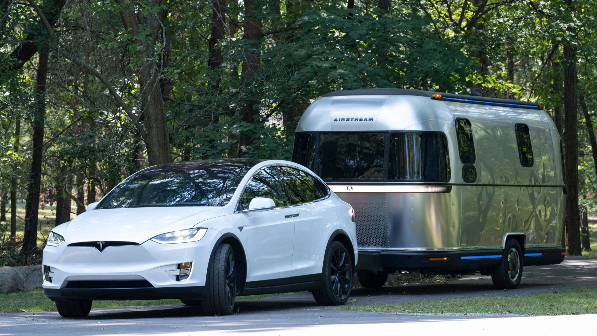 Airstream eStream travel trailer towed by a Tesla