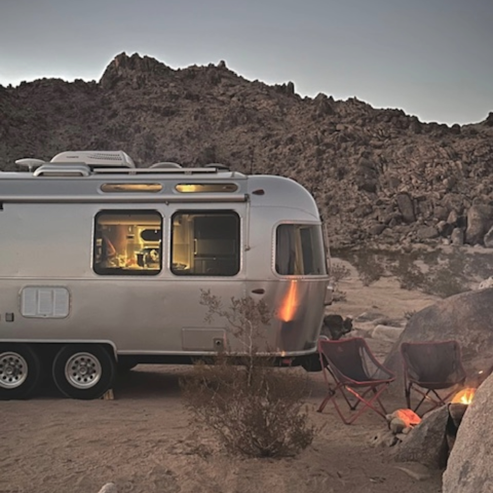 Airstream Globetrotter at a mountain view campsite