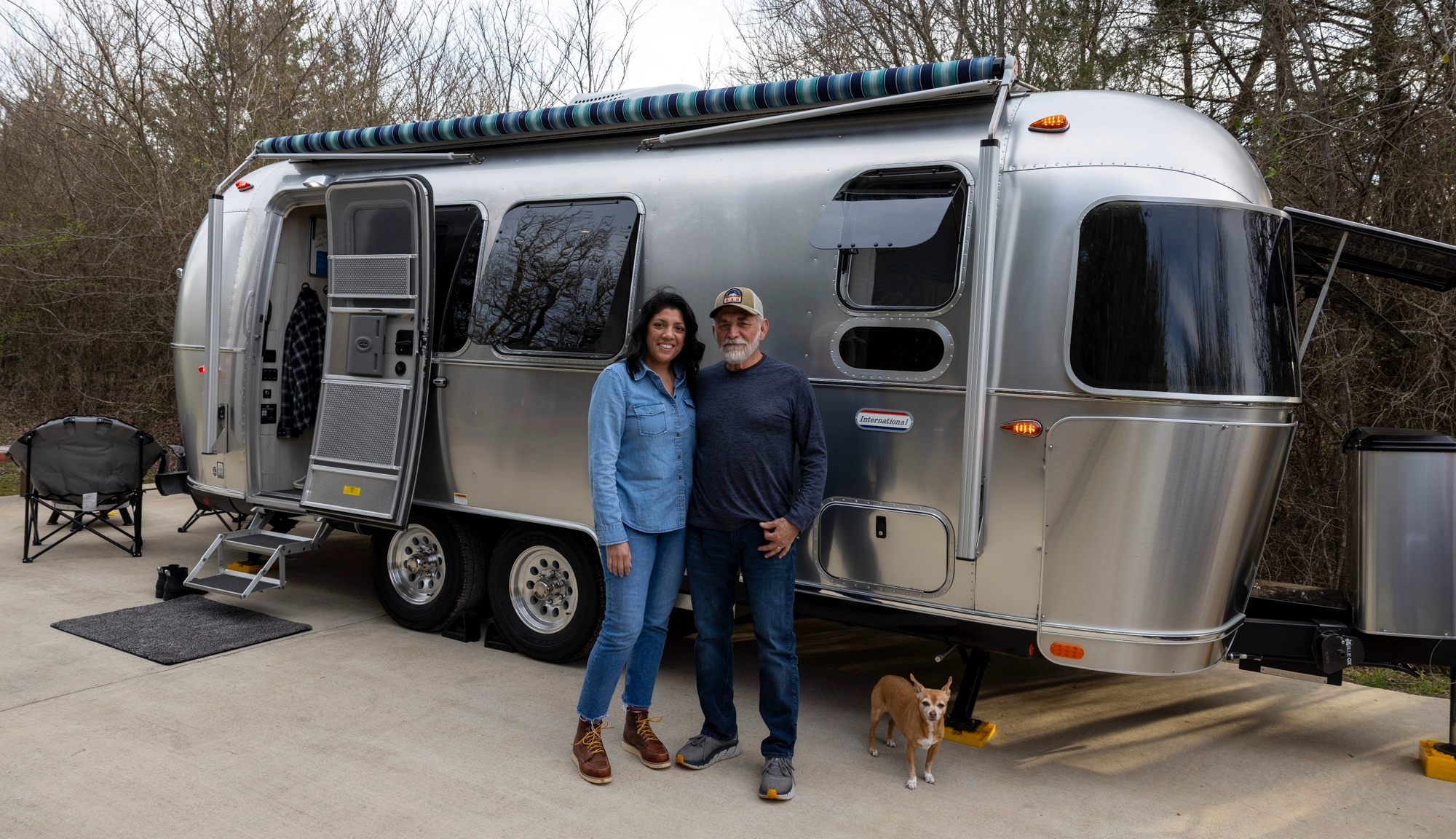 Janie and Mac Gracia infront of her Airstream International Travel Trailer