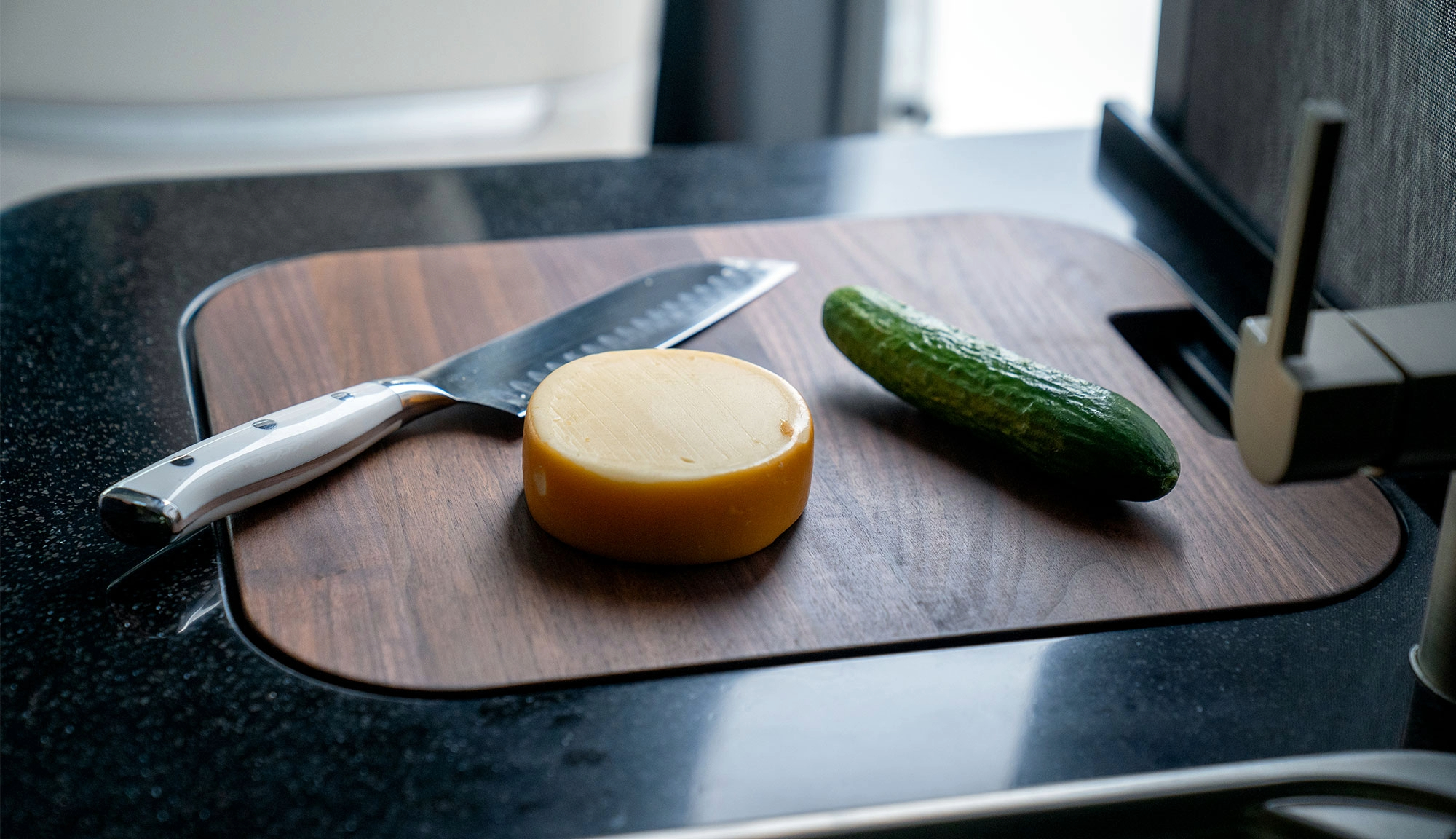 Cutting board sink attachment with cut up vegetables from Airstream Supply Company