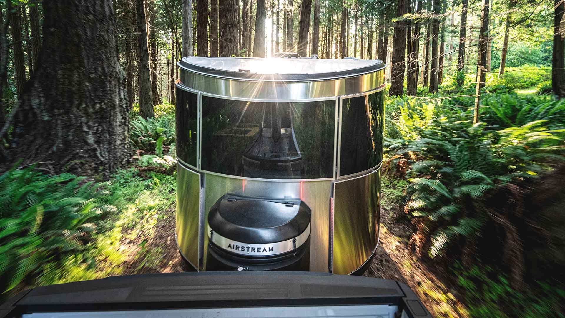 Basecamp-Exterior-towing-in-woods