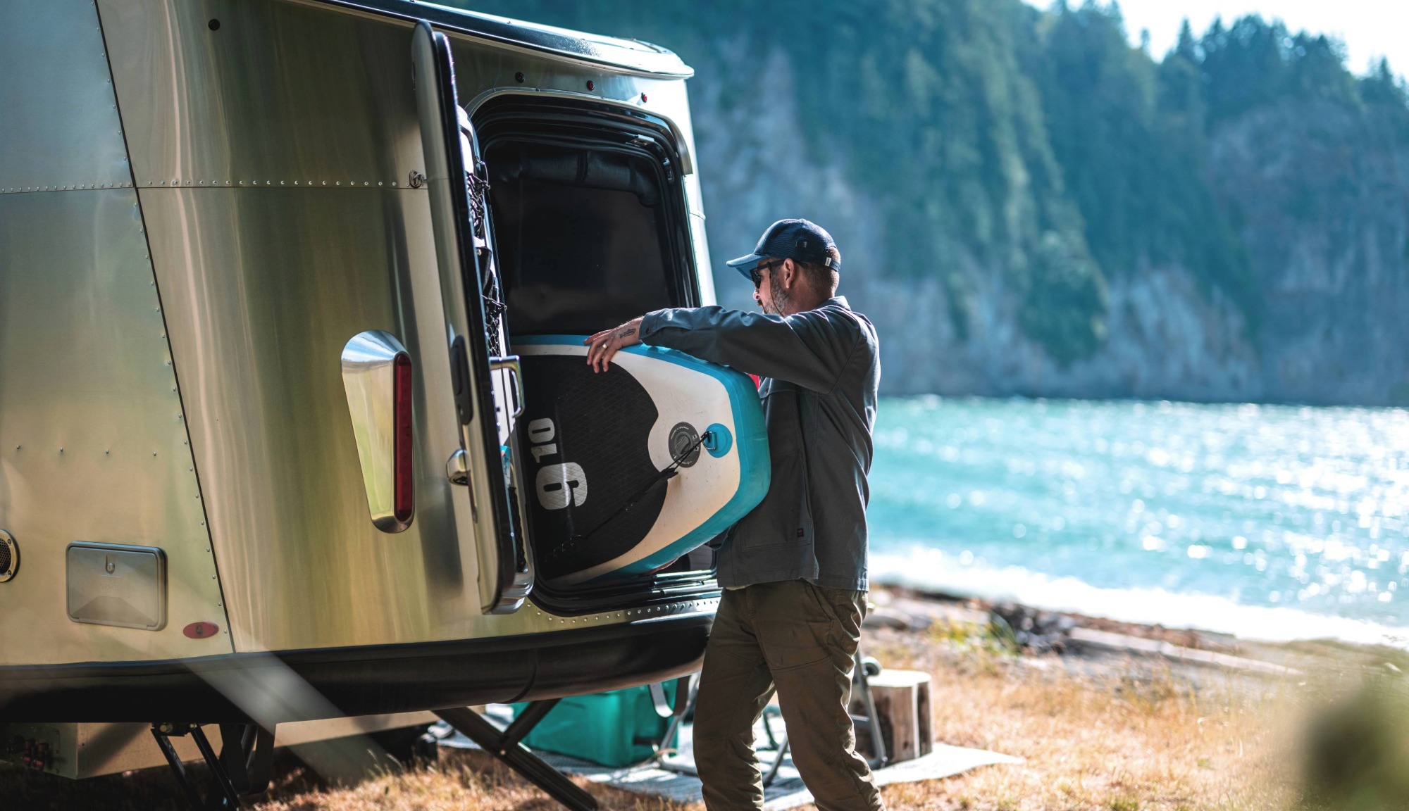 Airstream Basecamp Travel Trailer Lifestyle Surfing Shot