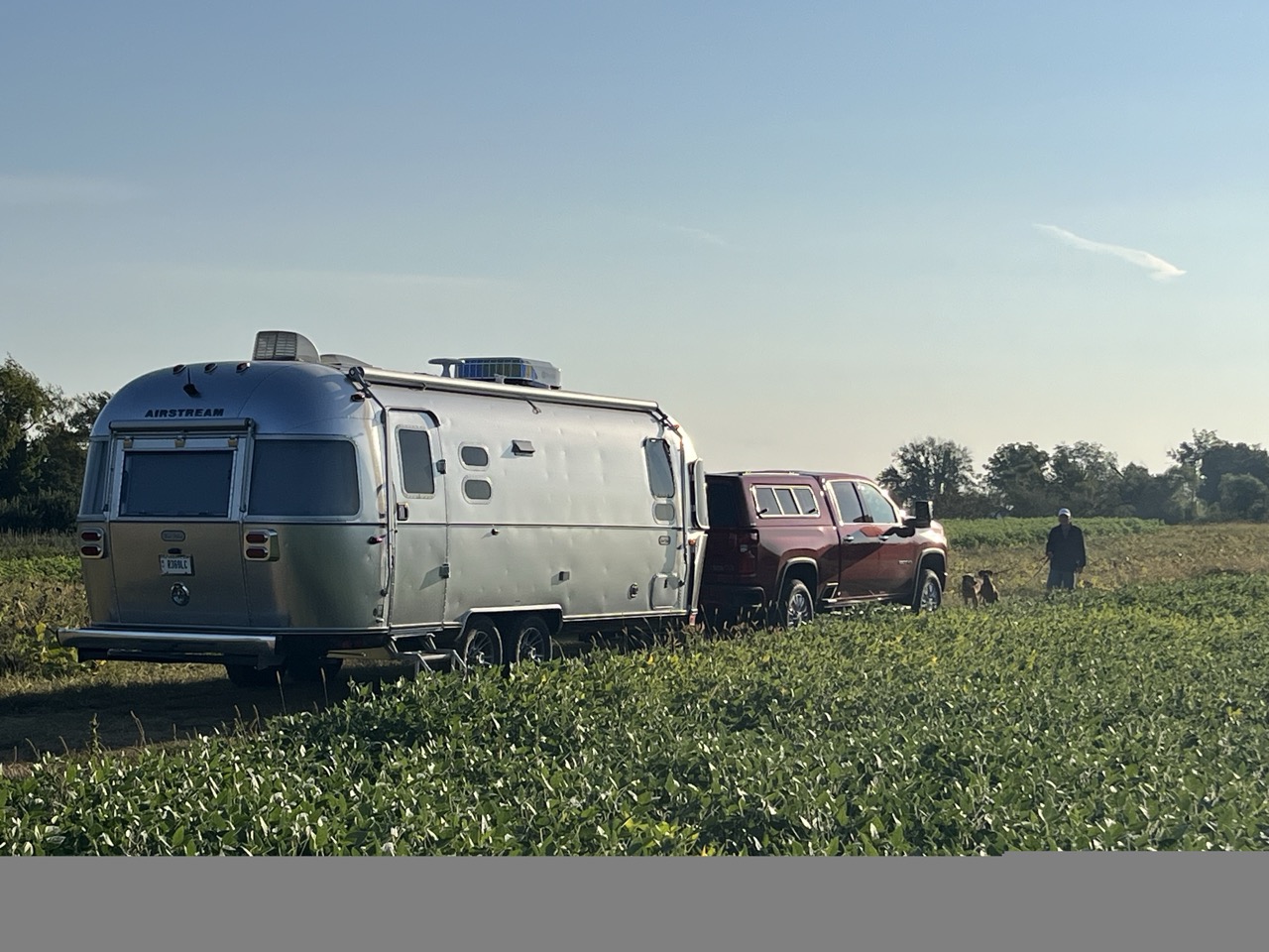 Bruce and Dawn Cordray Airstream Trade Wind Travel Trailer parked at an Orchard