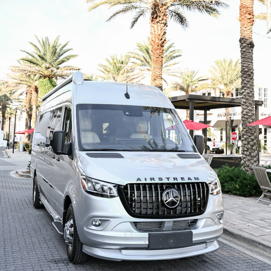 Airstream Tommy Bahama Touring Coach in front of Palsm Trees