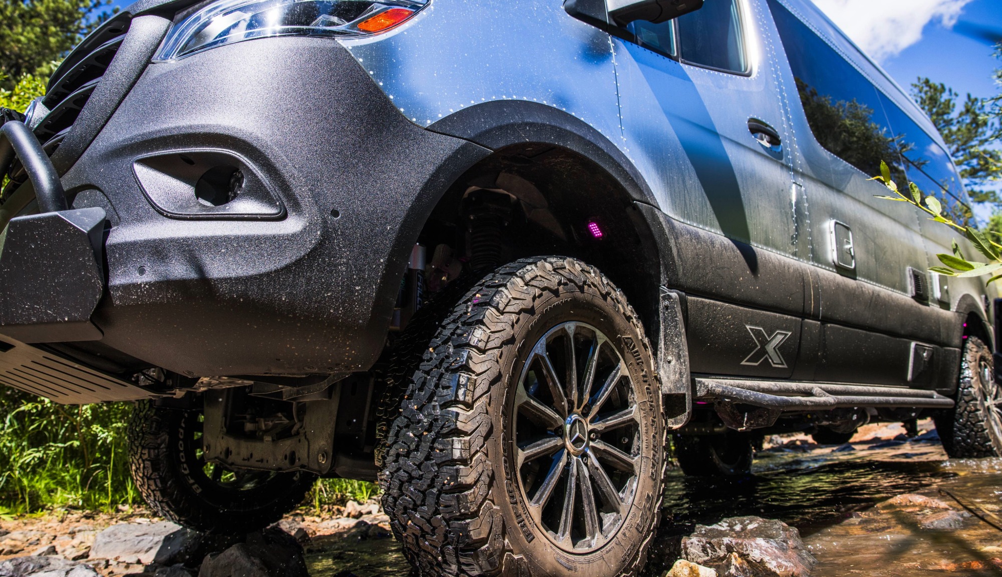 Close up of Airstream Interstate 19X Outland Edition Touring Coach wheels and protective coating