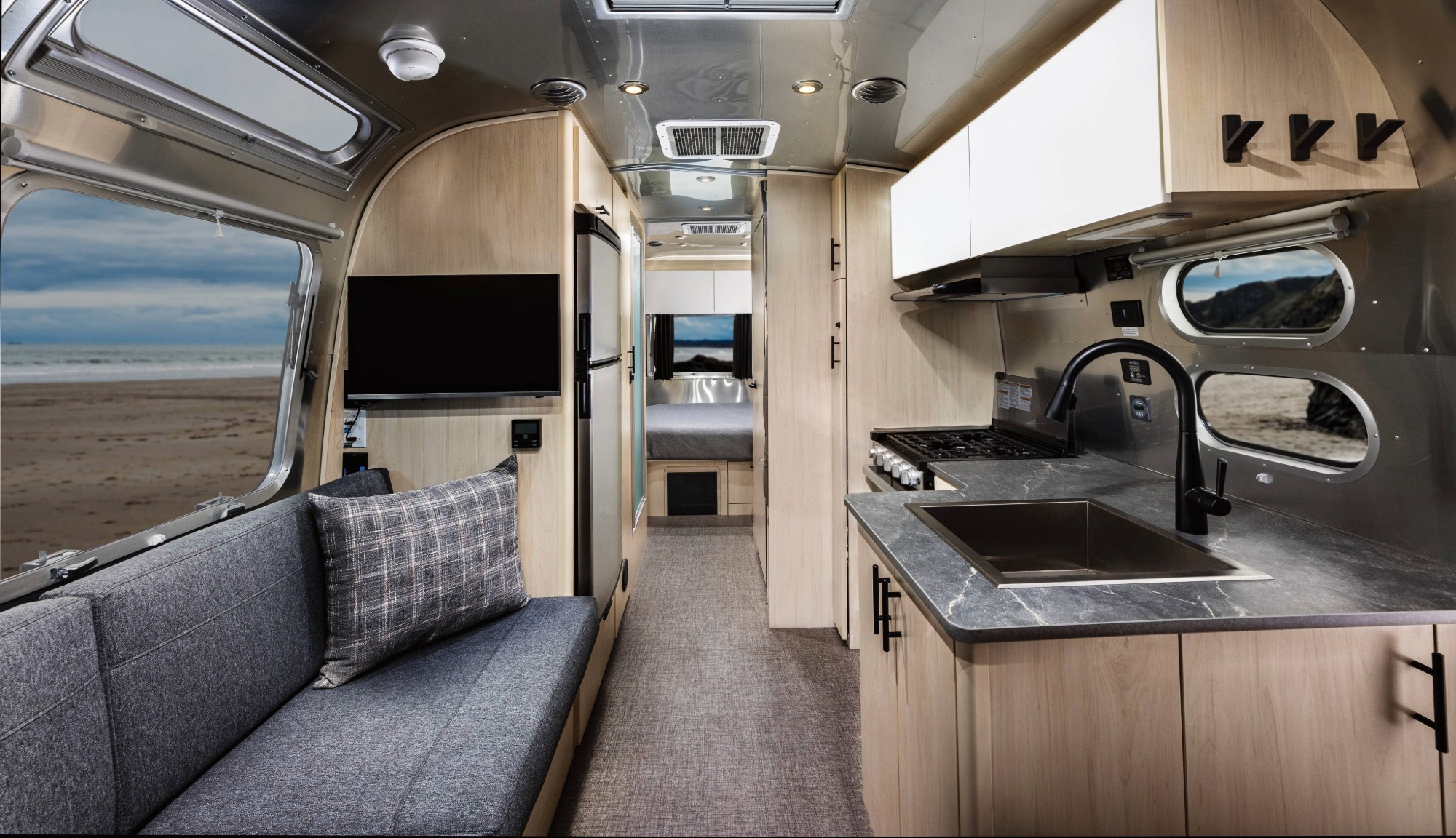 Interior front to back view of the Airstream Midnight Flamingo Flying Cloud