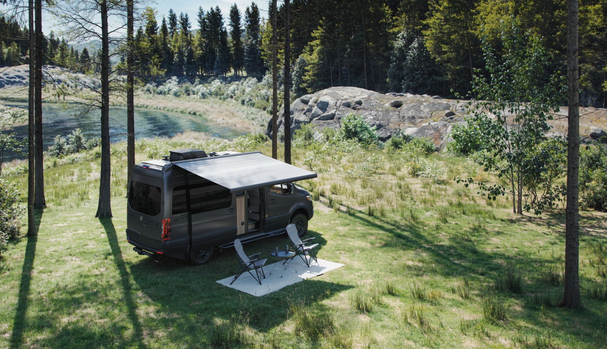 Airstream Tenorite Grey Interstate 19GTX campsite by the water
