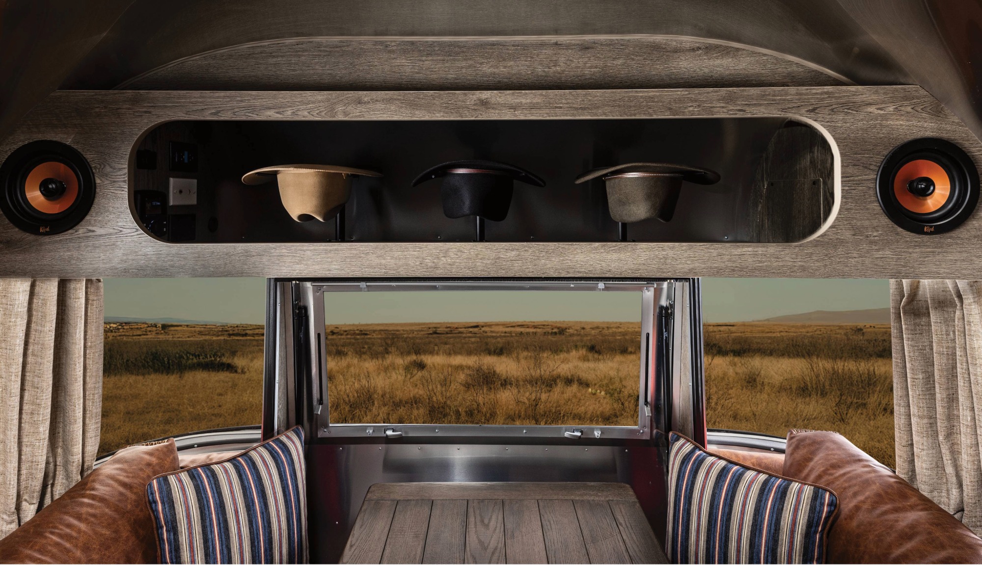 Closeup feature of the Stetson + 6666s Limited Edition Travel Trailer Hat Rack above the dinette