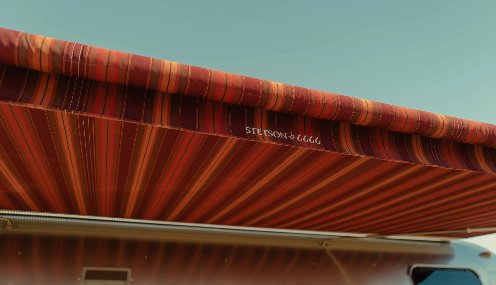 Closeup feature of the Awning stitching and Stetson + 6666s Logo on the Travel Trailer