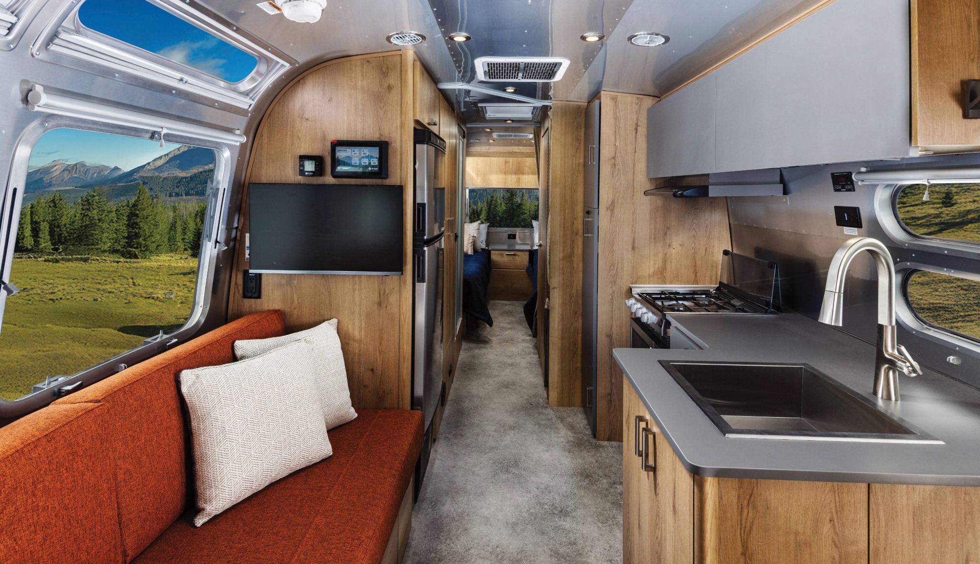 Interior back to front view image of Airstreams 27 foot Trade Wind Travel Trailer in the Terracotta decore