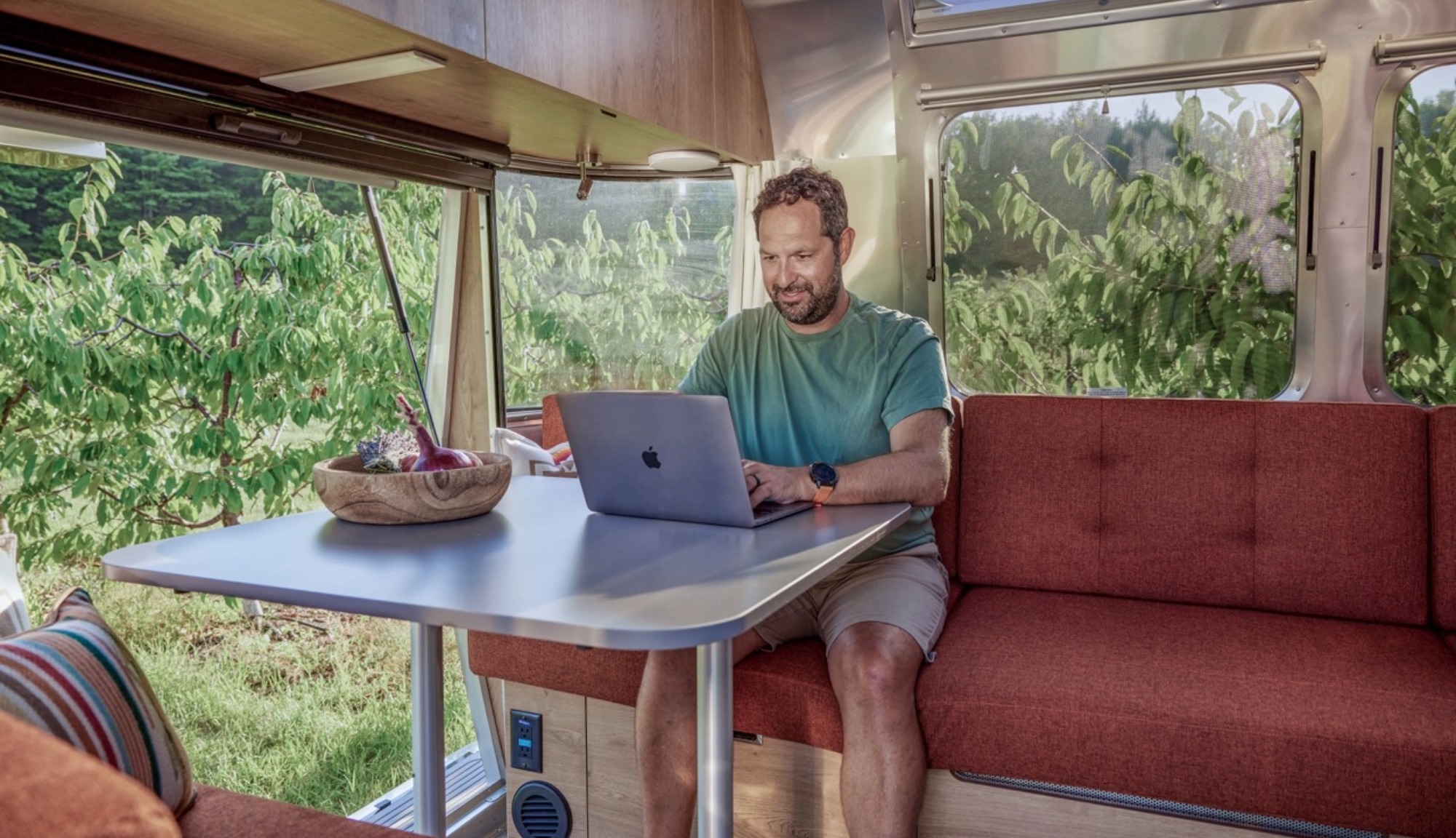Interior dinette image of the Airstream Trade Wind Travel Trailer in Terrcotta decore