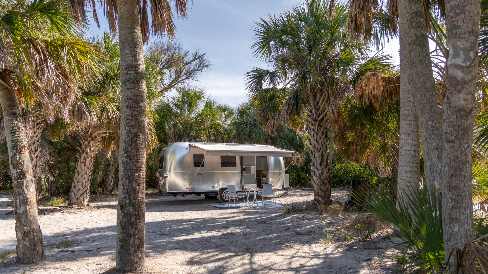 Airstream World Travler Travel Trailer camped on a beach in Tampa