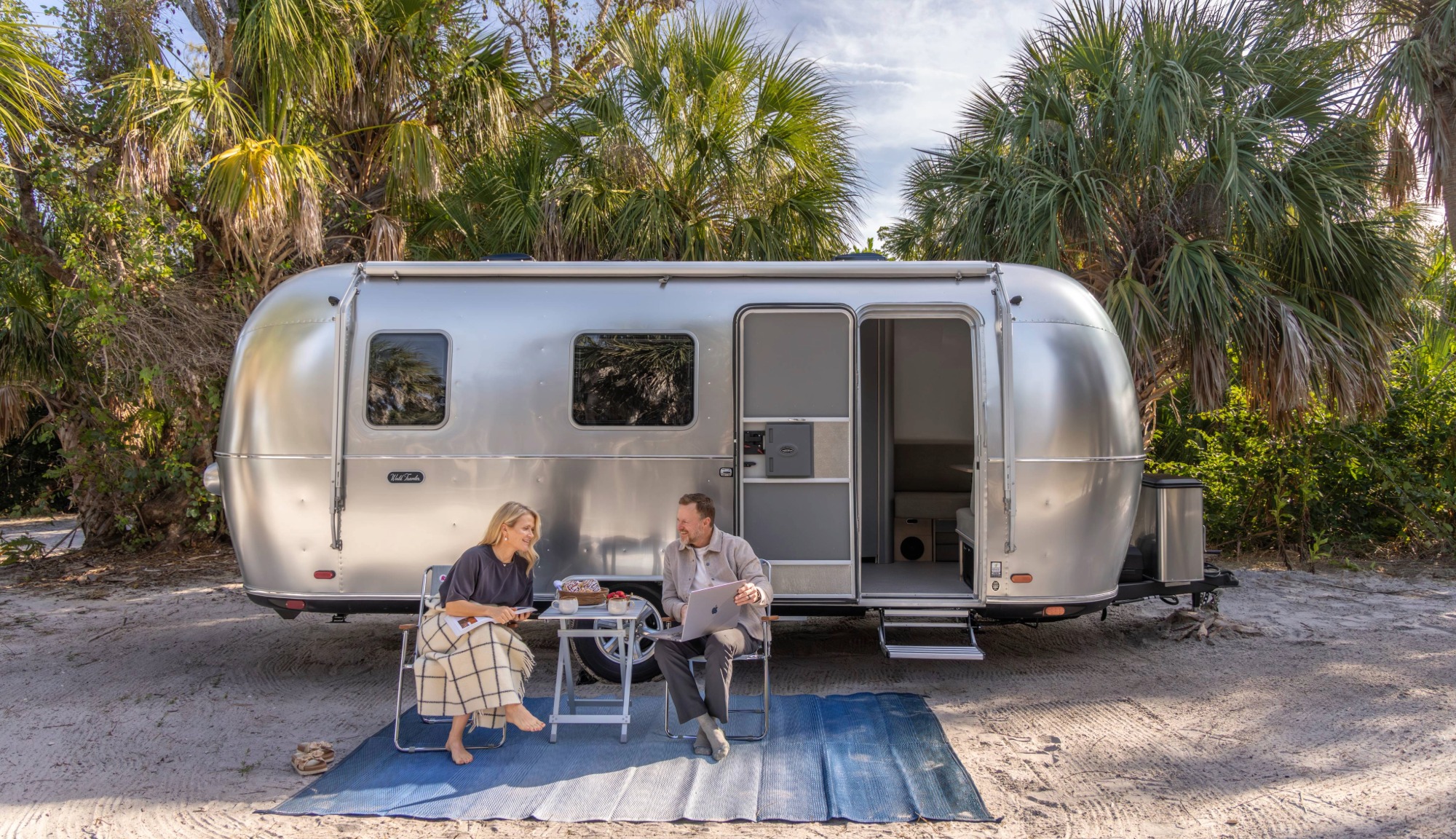 Marc and Tricia Leach, Keep Your Daydream camped outside Airstreams new World Traveler Travel Trailer