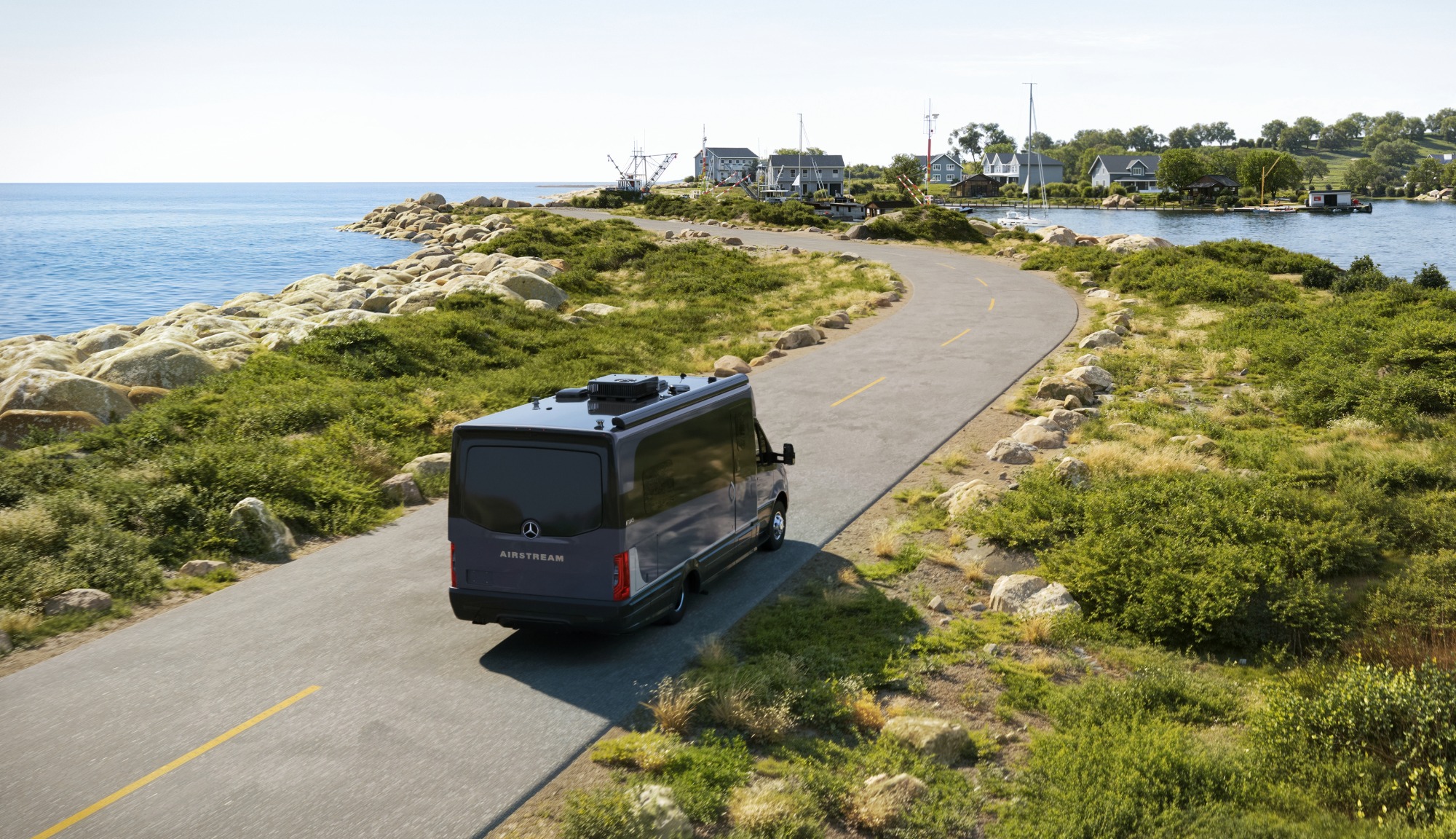 Airstream Atlas 25RT in Tenorite Gray Ultra Premium Paint Driving on a Maine Coast