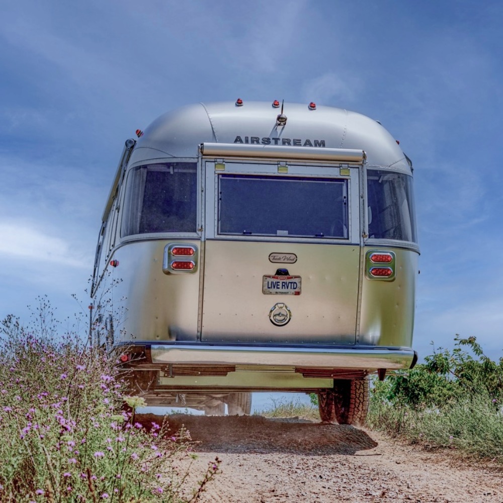 Exterior image of an Airstream Trade Wind Travel Trailer in tow