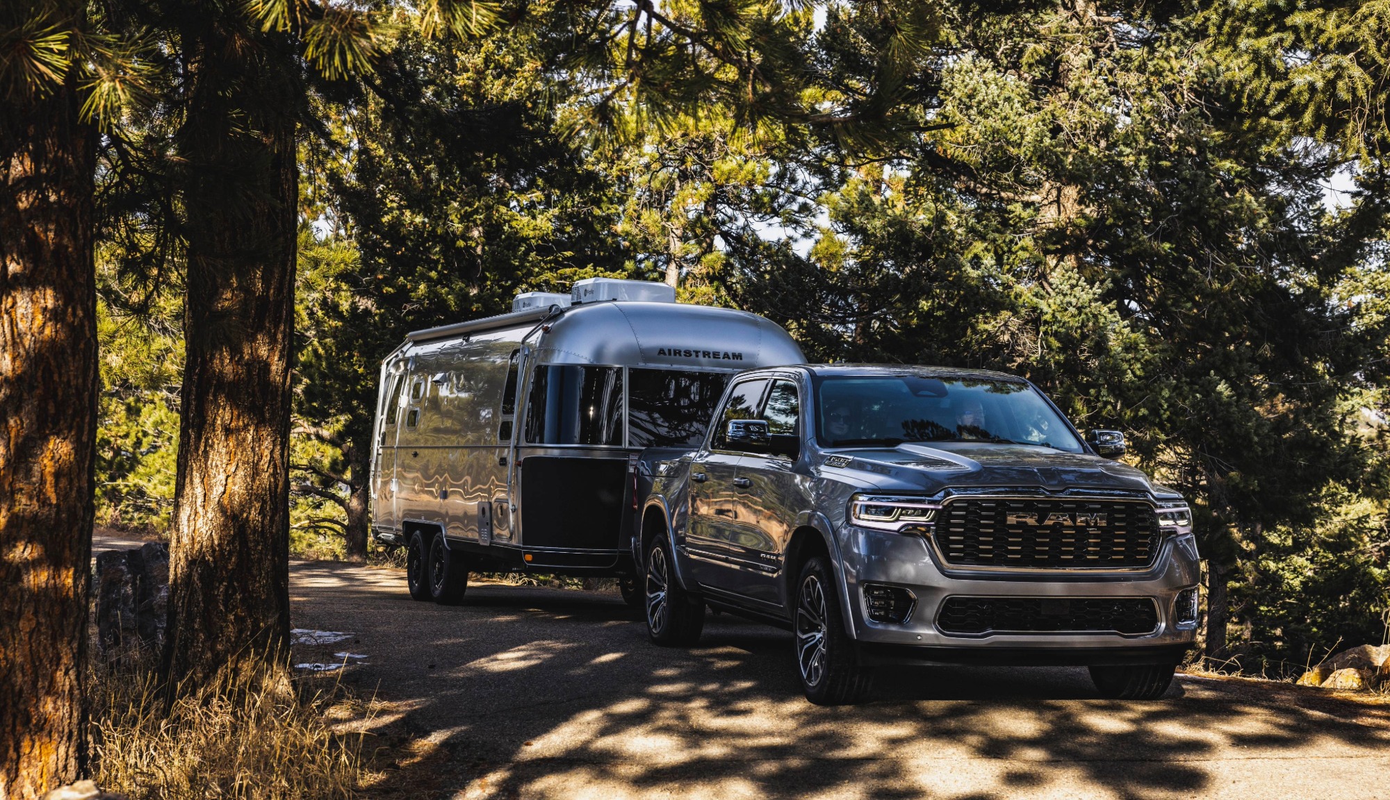 Airstream Flying Cloud Midnight Flamingo in tow behind a RAM truck