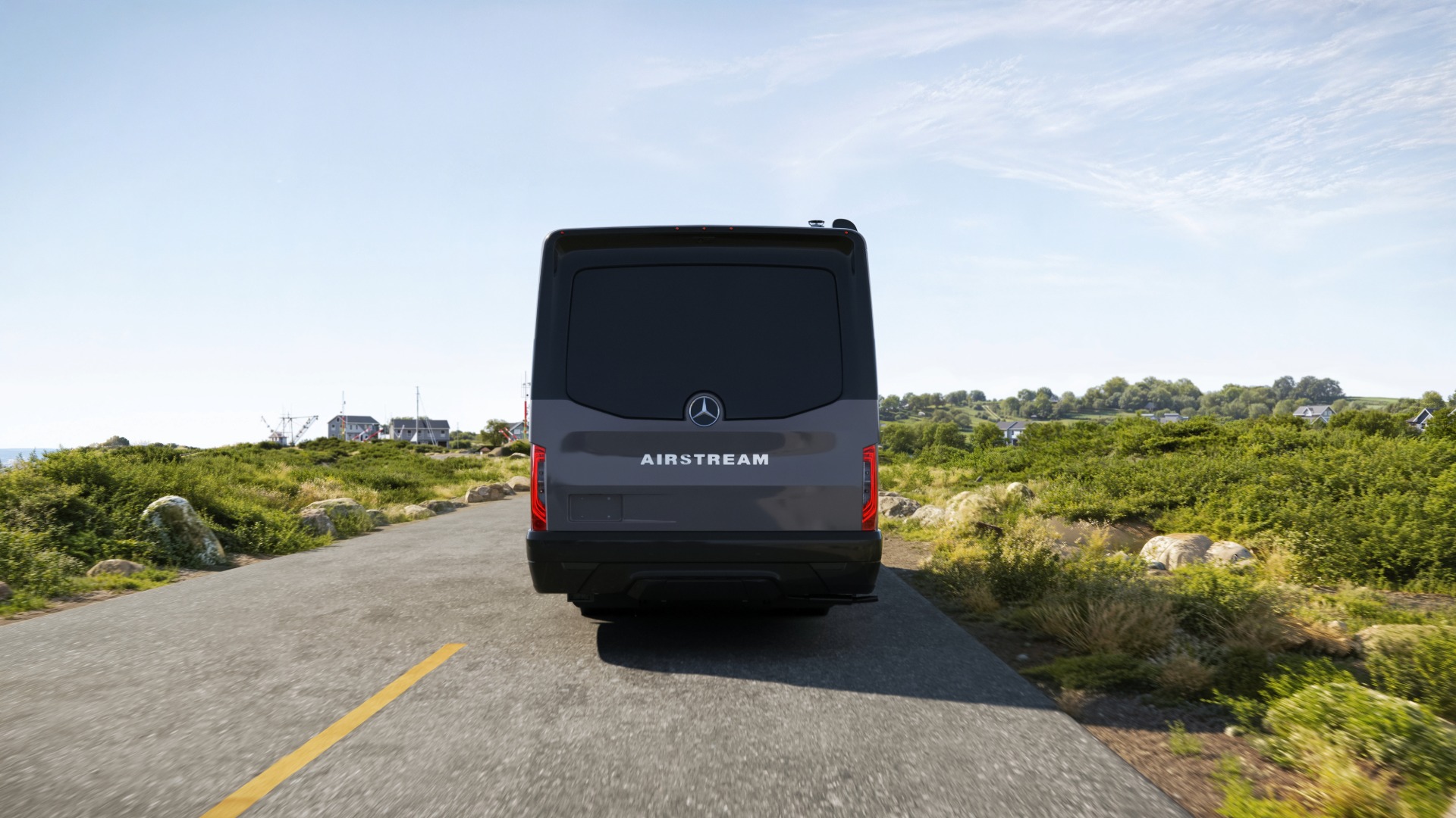 Tenorite Gray Ultra Premium Paint Atlas Camper Van rear view driving down the road