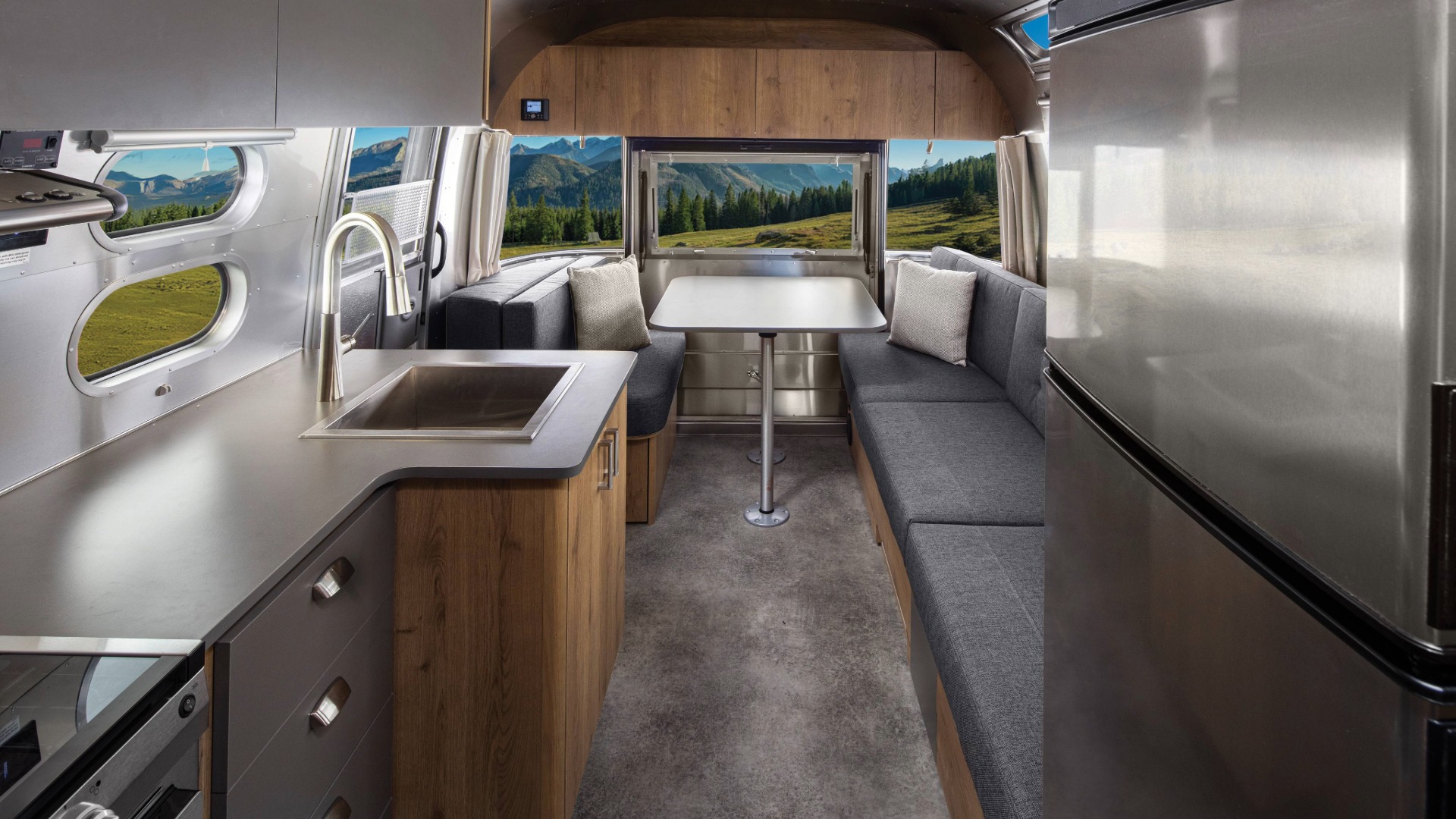 Trade Wind 27 interior image back to front featuring the gray L-shaped dinette lounge